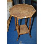 A small bamboo table with lower shelf.