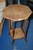 A small bamboo table with lower shelf.