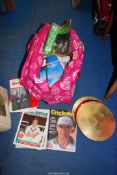 A large quantity of Cricket magazines, circular cake/place mats in pink trolley bag.