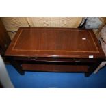 A coffee table with lower shelf and two drawers, 39" x 19 1/2" x 19" high.