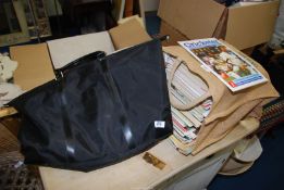 A large quantity of Cricket magazines and a large Ralph Lauren bag.