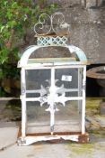 A painted metal and glass lantern, 11'' base x 6'' x 19 1/2'' high.
