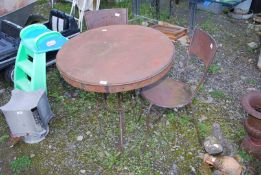A metal garden table, 32'' diameter x 28 1/2'' high, and two chairs.