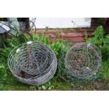A quantity of wire hanging baskets.
