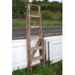 A six rung wooden stepladder by 'The Hatherley' group.