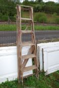 A six rung wooden stepladder by 'The Hatherley' group.