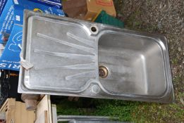 A stainless steel single drainer sink top.