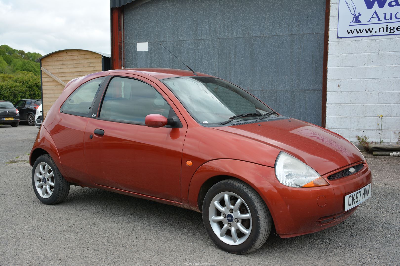 A Ford KA Zetec Climate 1299cc petrol-engined three door hatchback motor Car finished in red,