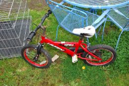 A child's red bike.