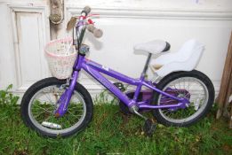A child's Pop Rock bike with doll carrier.