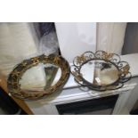 Two mirrors with metal surround.