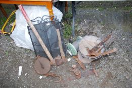 A log splitter, axe, bucket of heavy duty ball and jaw towing bar, wire rope, spark guard,