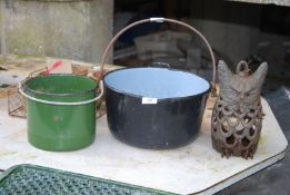 Two cooking pots and an owl candle holder.