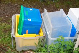 A quantity of plastic storage boxes.