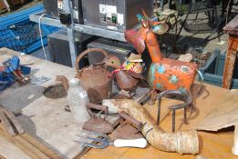 A quantity of garden ornaments, kettle, cow, down pipe, etc.