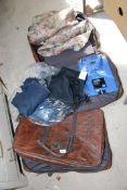 Two leather suitcases, lined curtains and mens clothing.