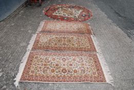Three matching rugs 4" x 2" by Wilton carpets plus a circular 5' rug.
