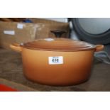 A brown Le Creuset casserole dish with lid