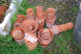 A quantity of mixed terracotta pots.