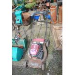 A Honda lawn mower, (engine turns at time of lotting), no grass box.