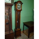 A Westminster chiming Grandmother clock, with presentation plaque.