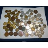 A quantity of mixed coins including threepences, pennies, foreign, etc.