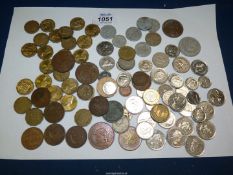 A quantity of mixed coins including threepences, pennies, foreign, etc.