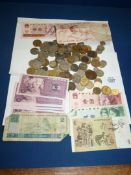 A quantity of foreign coins and paper notes.