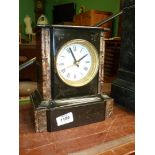 A small marble and slate Mantle Clock, white enamel face with quartz mechanism,
