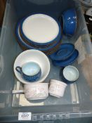 A quantity of mottled blue Denby dinnerware to include; dinner & side plates, cups & saucers, etc.