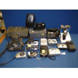 A quantity of cased digital compact Cameras including Canon, Samsung, Prinz 770 flash unit, etc.