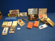 A quantity of old playing cards, Dominoes, draught pieces, lead warship, cars, etc.