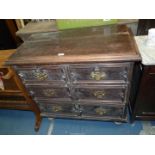 A dark Oak and other woods Chest of two long and two short Drawers of Jacobean design,