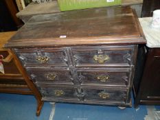A dark Oak and other woods Chest of two long and two short Drawers of Jacobean design,