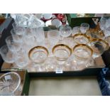 A quantity of glasses including sherry, wine and tumblers, some with gold rims.