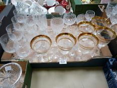 A quantity of glasses including sherry, wine and tumblers, some with gold rims.