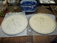 Two circular plaster Plaques depicting Putti in relief, a/f, 19 1/2" diameter.