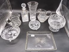 A quantity of glass including a glass tray with star like pattern and large vase with leaf pattern