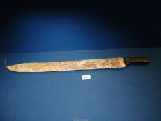 A Martindale machete, no. 1055, in cow hide covered sheath.