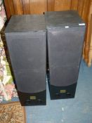 A pair of black Ash cased Tower Speakers by Acoustic Reference, model SM-1000.
