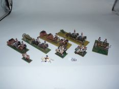 A quantity of lead horse drawn Napolean units including gun carriages, arms wagons, etc.