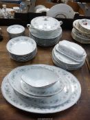 A Noritake 'Wellesley' eight person dinner service including dinner and side plates,