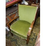 A circa 1940 Darkwood framed low open armed Elbow Chair having emerald green upholstered back rest
