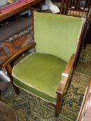 A circa 1940 Darkwood framed low open armed Elbow Chair having emerald green upholstered back rest