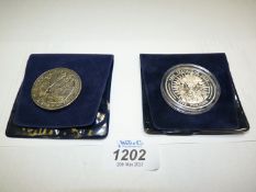 Two £5 coins; one to commemorate the Battle of Trafalgar, the other 2005 Gibraltar.