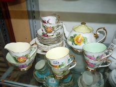 A six setting Roslyn china Tea service in 'Wheatcroft Roses' design including; teapot, sugar bowl,
