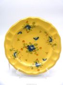 An unusual yellow Faience plate, probably 18th century French or Italian,