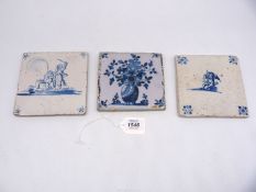 Three Dutch Delft tiles one with flowers in vase,