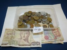 A tub of foreign coins and notes.