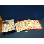 A stamp album titled 'The Victory' containing foreign and British stamps,